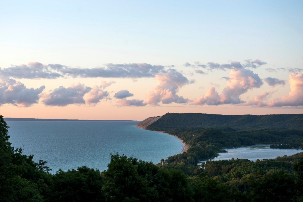 Spectacular aerial view of summer sunset looking over the bluffs of the sleeping bear dunes national lake shore in Empire Michigan