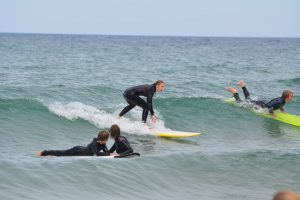 people surfing the waves of lake michigan