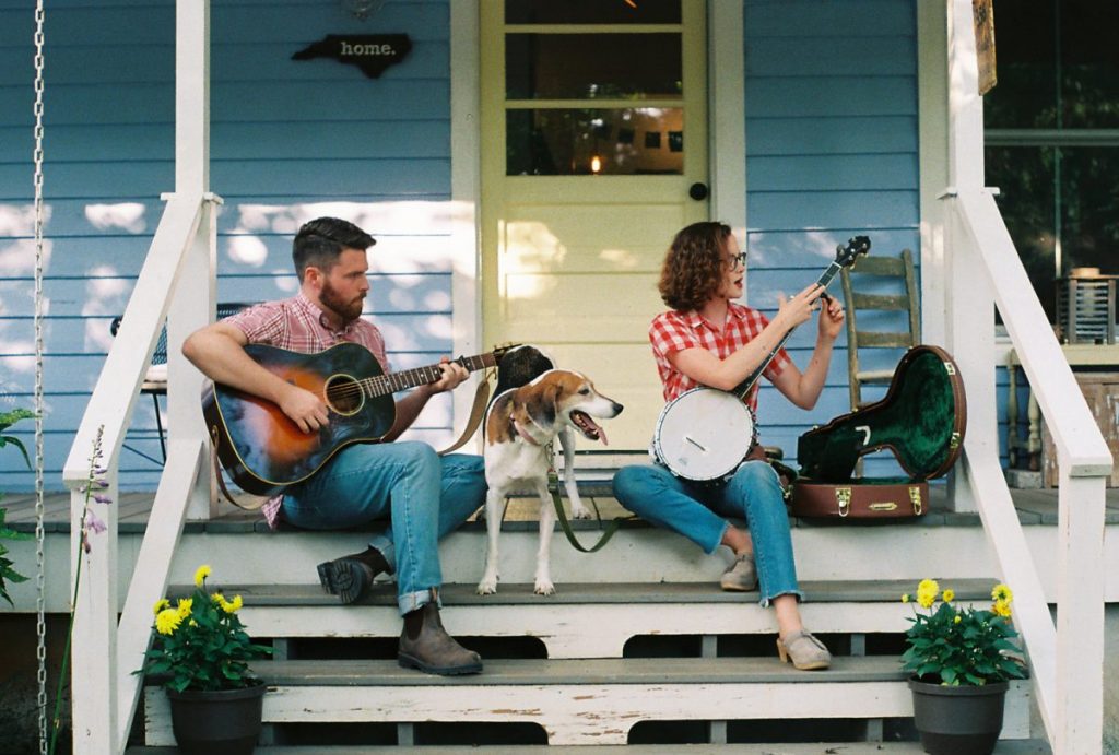 photo of musicians on porch with dog: Chatham Rabbits