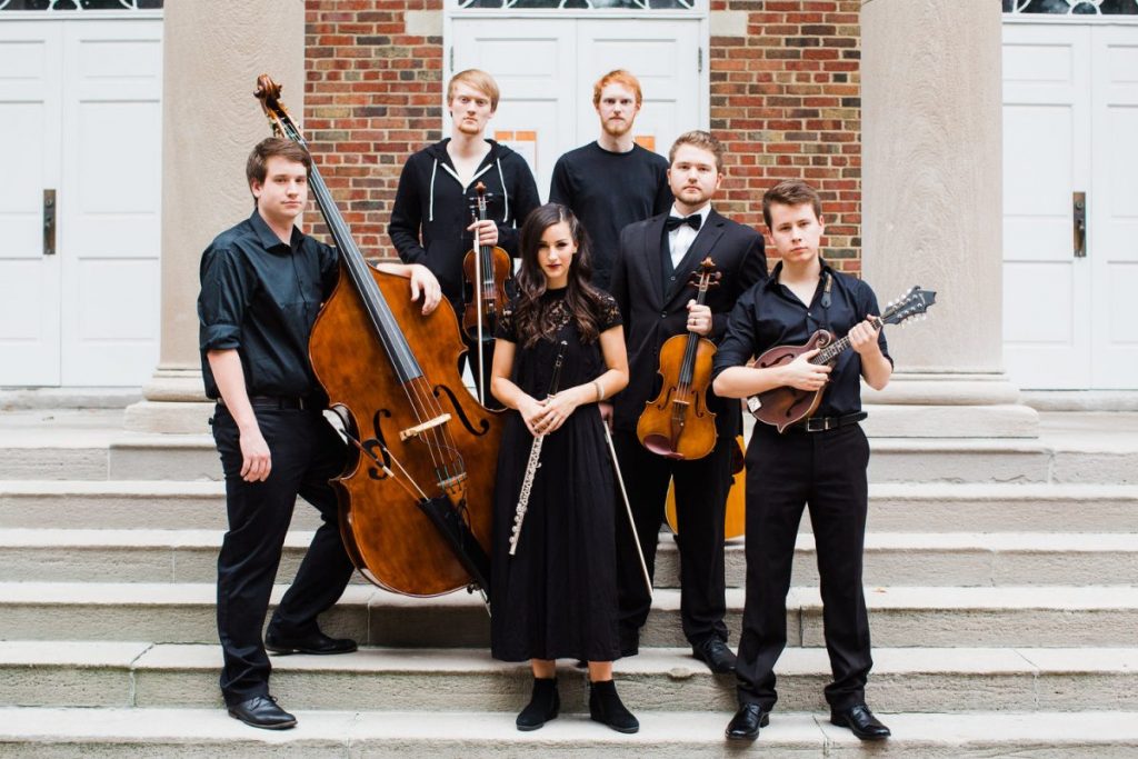 The Fouding band posing on staircase