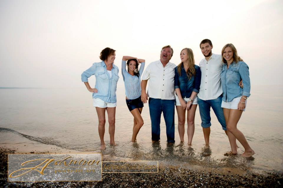 family posing on beach for Ashmun Portrait Art