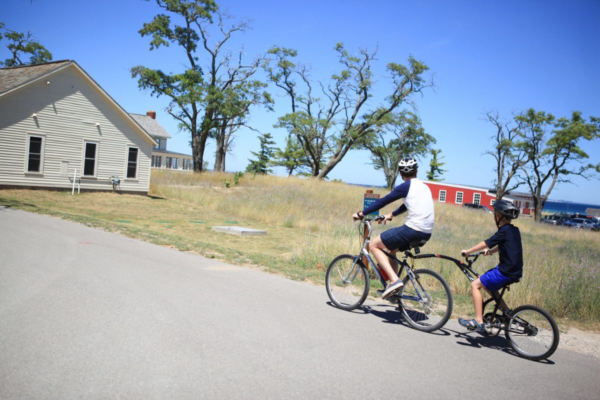 father and son biking the heritage trail at historic glen haven
