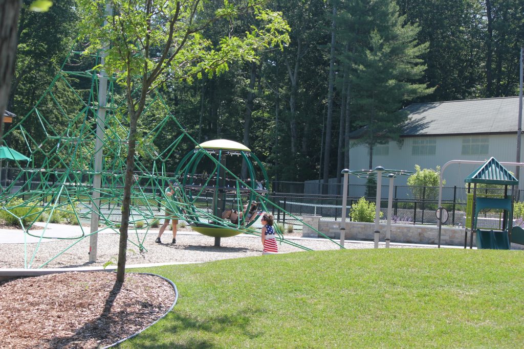 playscape and green grass at town park