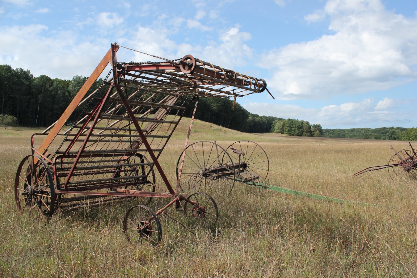 antique farm equipment in field