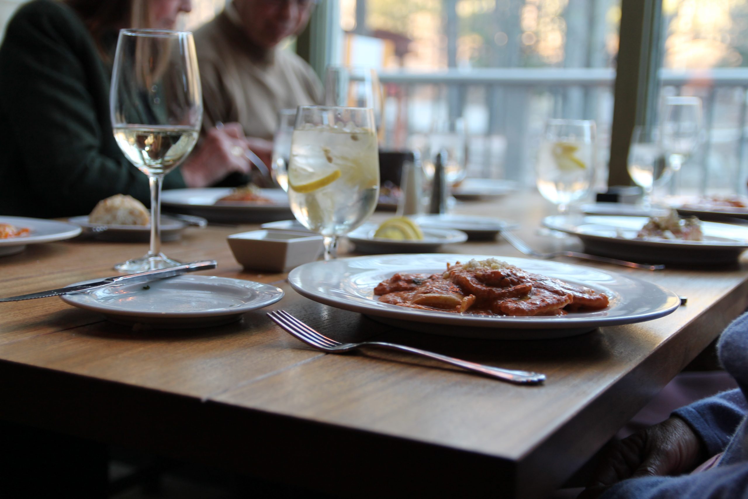 another dining photo of dinner and glasses close up