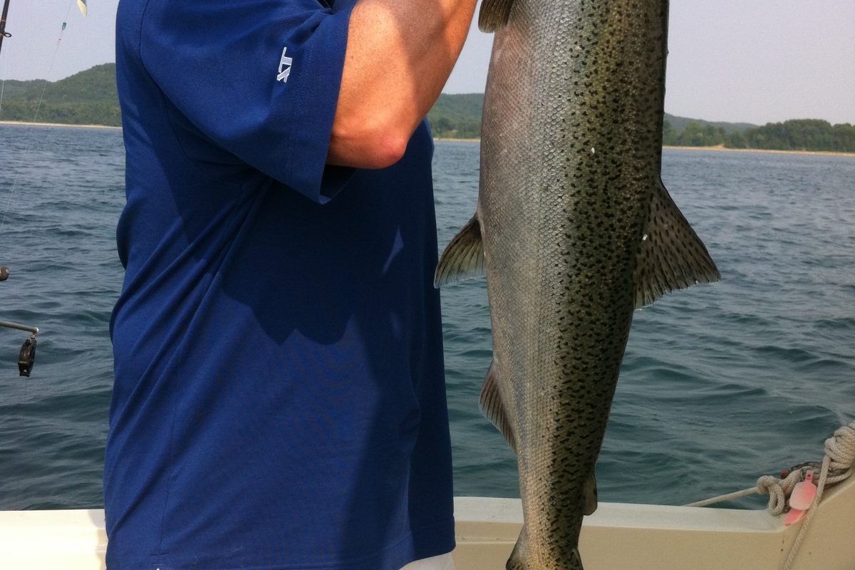 Reel Tales charter - guy holds big catch