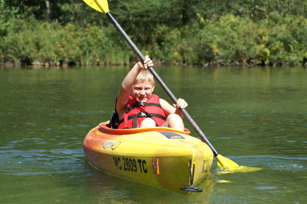 child kayaking
