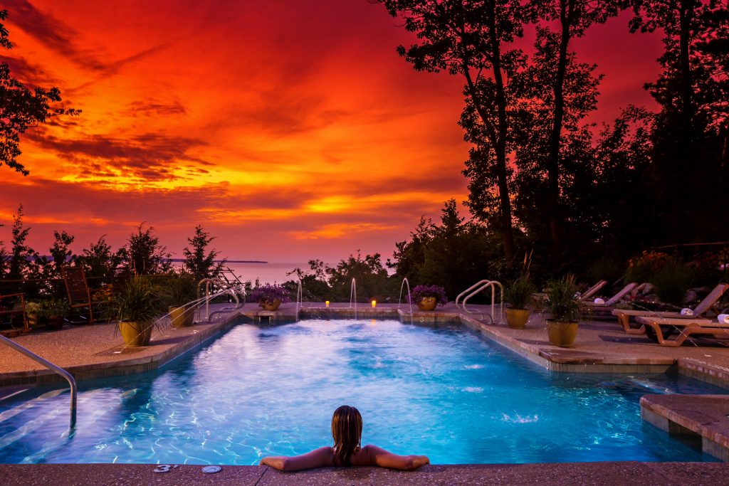 luxurious sunset view of pool overlooking lake at Spa Amira