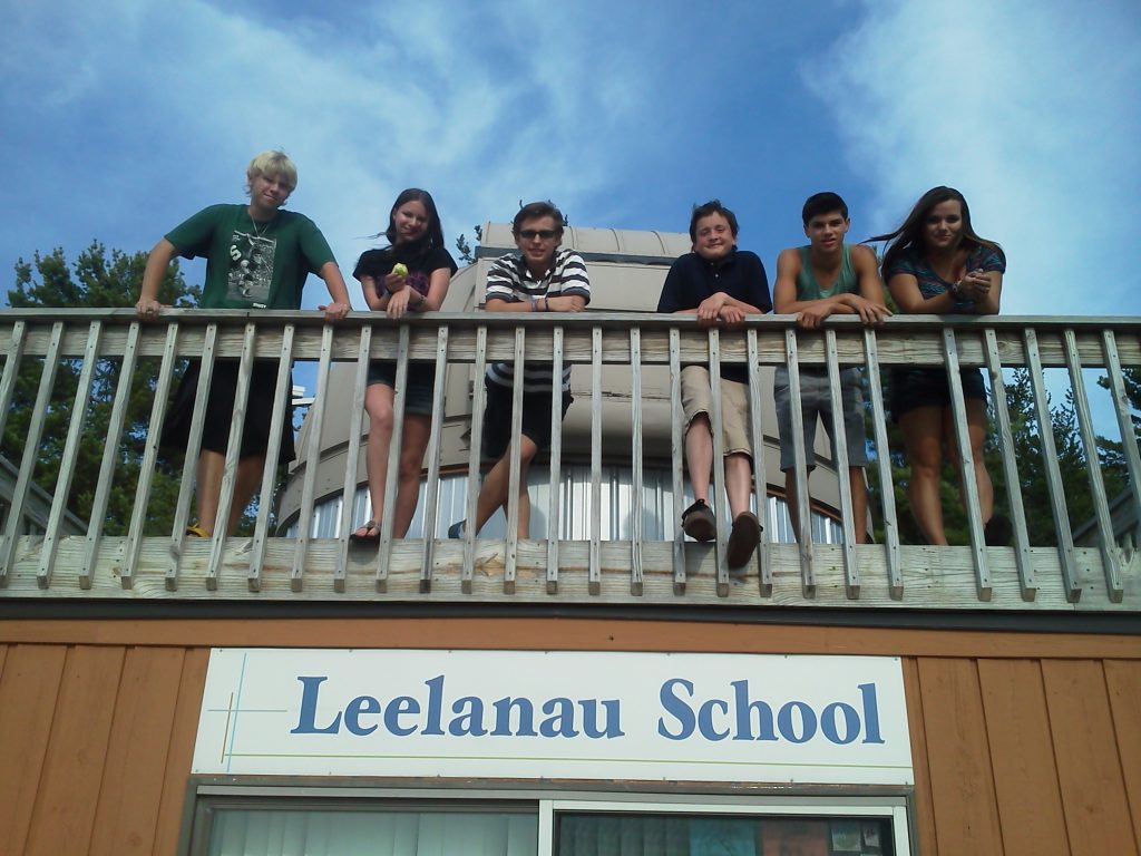 kids hang onto deck rail at Leelanau School