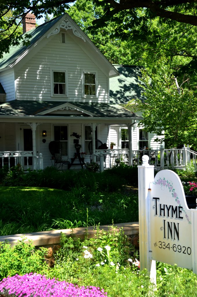 Thyme Inn sign and Inn gardens out front