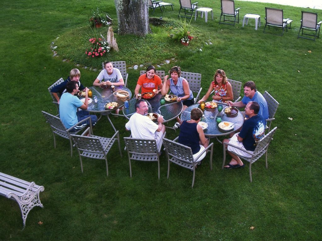 family dinner backyard picnic at Glen Lake Lodge