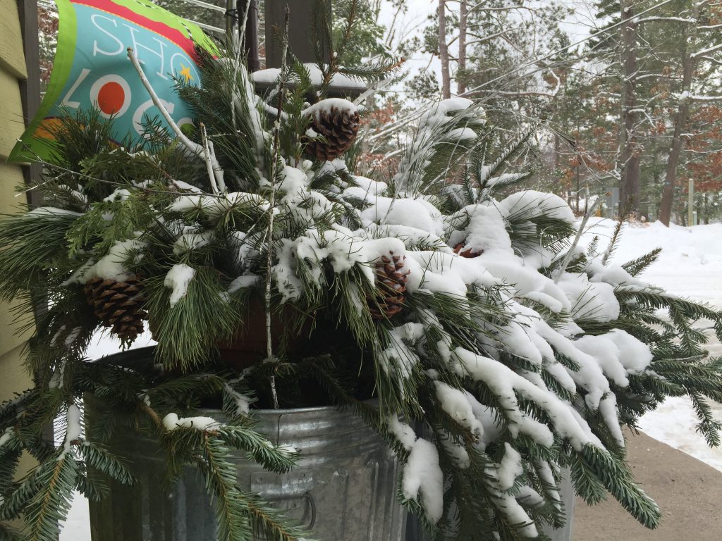 shop local flag in snowy evergreens container