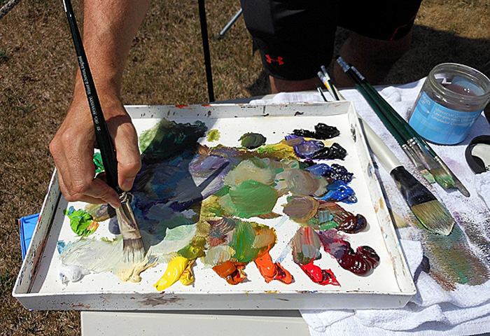 painters tray of many colorful acrylics up close during Art Center's Plein Air Weekend