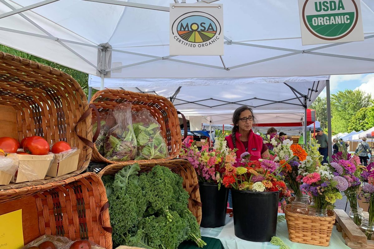 veggies and flowers at market stand