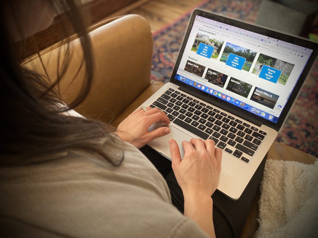 woman surfing on apple laptop