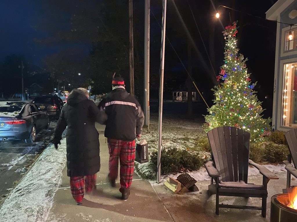 couple shopping glen arbor in festive pj's