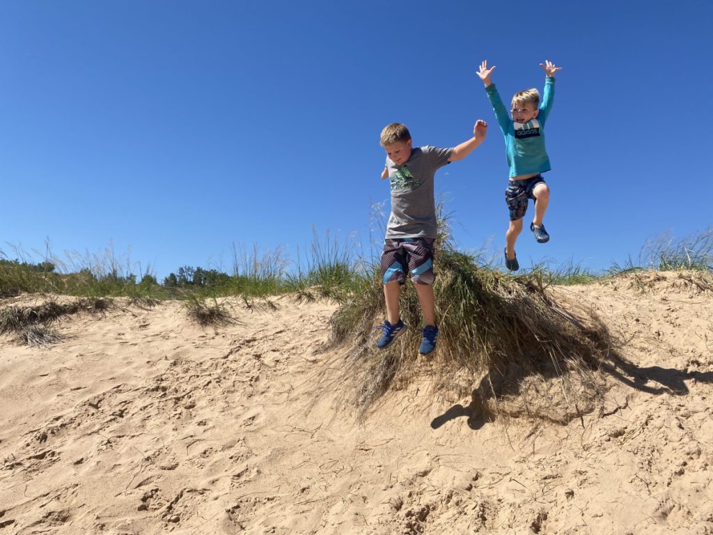 kids jumping; dune climb; sleeping bear dunes