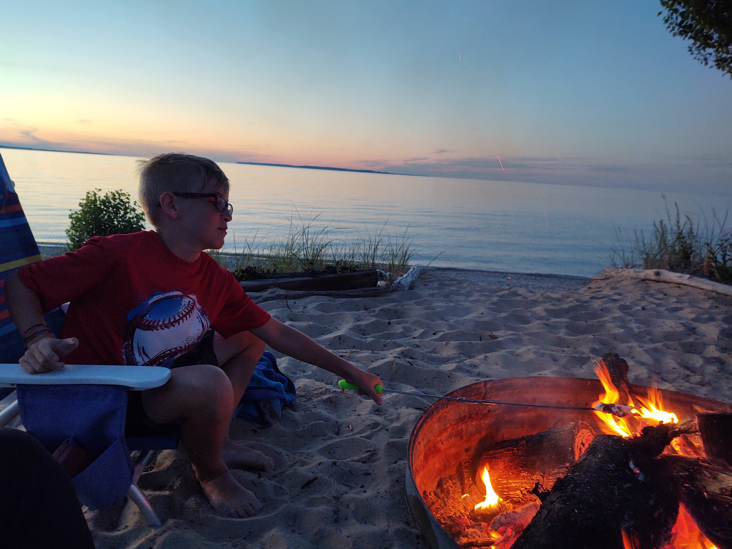 bonfire ring and lake michigan frontage beachside cottage vacation rental